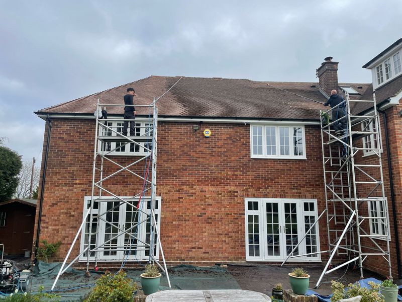 Roof cleaning carried out safely from scaffold towers by The Roof Moss Cleaners in Melksham